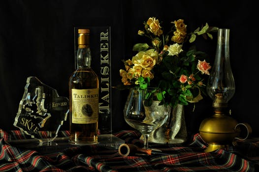 Tartan table spread with Islay Whisky gifts and flowers